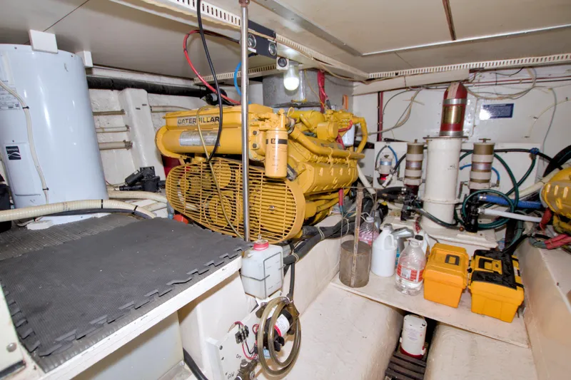 Slide: The Image of Engine room of 1985 Gulfstar 44 Motor Yacht with Caterpillar engine and maintenance tools. - 88