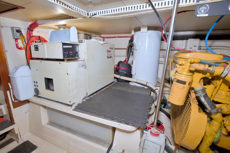 Slide: The Image of Engine room of 1985 Gulfstar 44 Motor Yacht with Onan generator and equipment. - 90