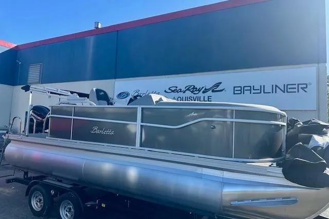 The Image of 2026 Barletta A20L pontoon boat on trailer at dealership. - 0