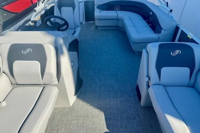 Slide: The Image of 2026 Barletta A20L boat interior with plush seating and modern steering console. - 4