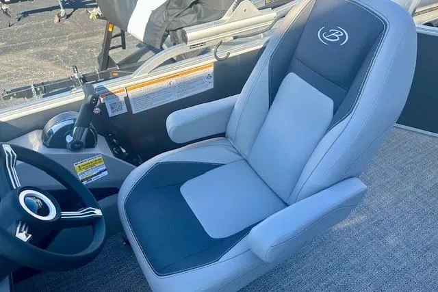 Slide: The Image of 2026 Barletta A20L boat interior with sleek captain's chair and steering wheel. - 7