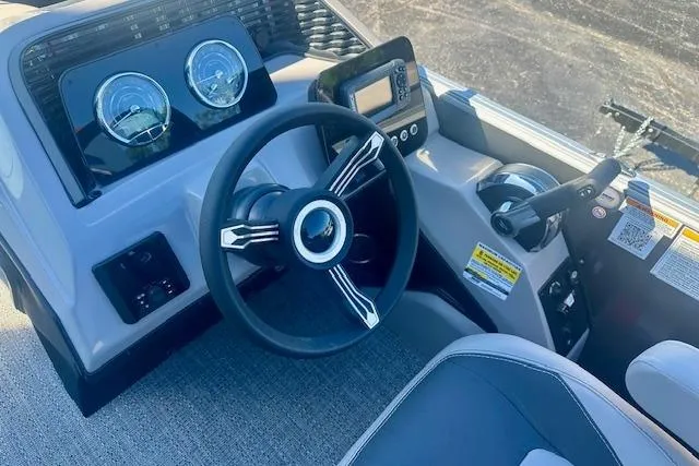 Slide: The Image of 2026 Barletta A20L boat dashboard with steering wheel and control panel. - 8