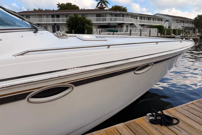 Slide: The Image of 2002 Formula 330 Sun Sport boat docked by waterfront homes. - 16