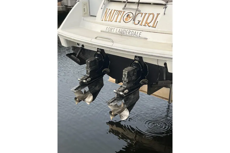 Slide: The Image of 2002 Formula 330 Sun Sport boat stern with dual propellers in Fort Lauderdale marina. - 19