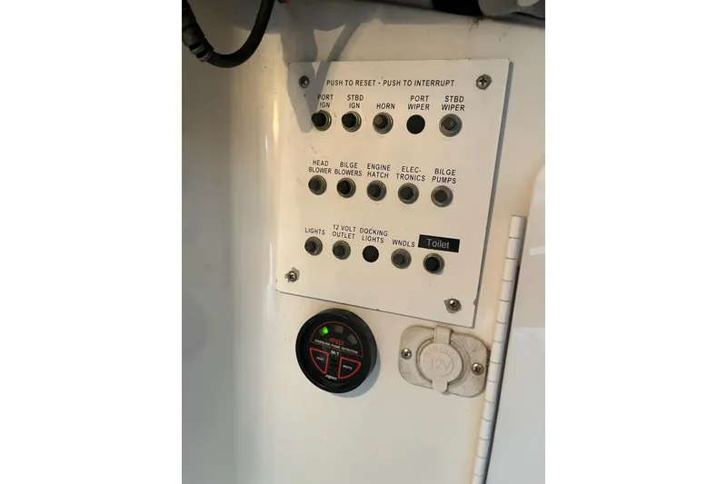 Slide: The Image of Control panel of a 2002 Formula 330 Sun Sport boat with various switches and indicators. - 29