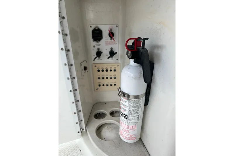 Slide: The Image of Fire extinguisher and control panel on 2002 Formula 330 Sun Sport boat. - 30