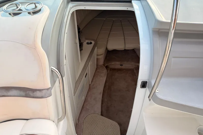 Slide: The Image of 2002 Formula 330 Sun Sport cabin interior with beige seating and carpet. - 41