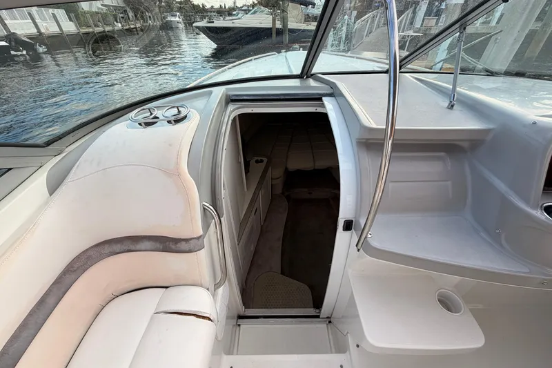 Slide: The Image of 2002 Formula 330 Sun Sport boat interior with cabin entrance and seating area. - 42