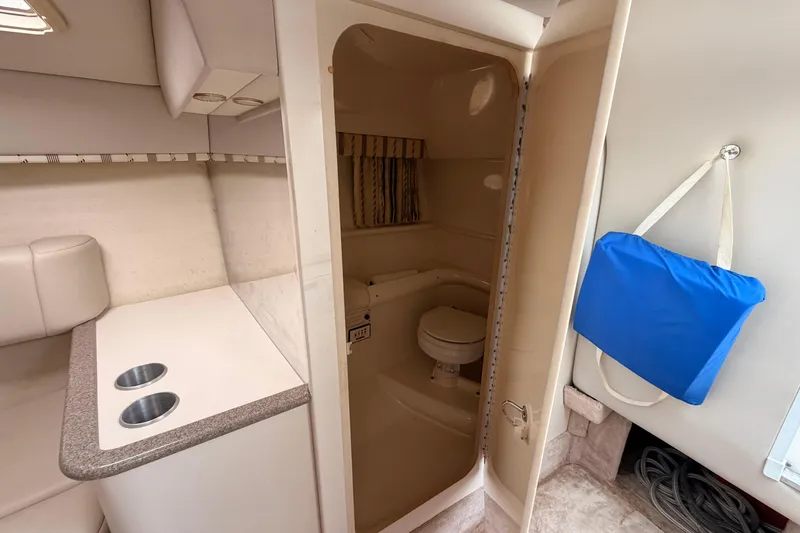 Slide: The Image of Interior of 2002 Formula 330 Sun Sport boat with compact bathroom and kitchenette. - 48