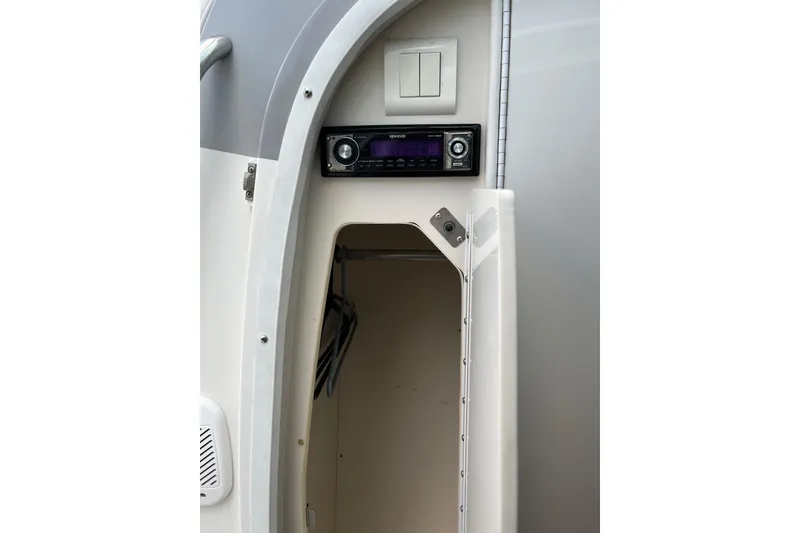 Slide: The Image of 2002 Formula 330 Sun Sport interior with stereo system and storage compartment. - 55