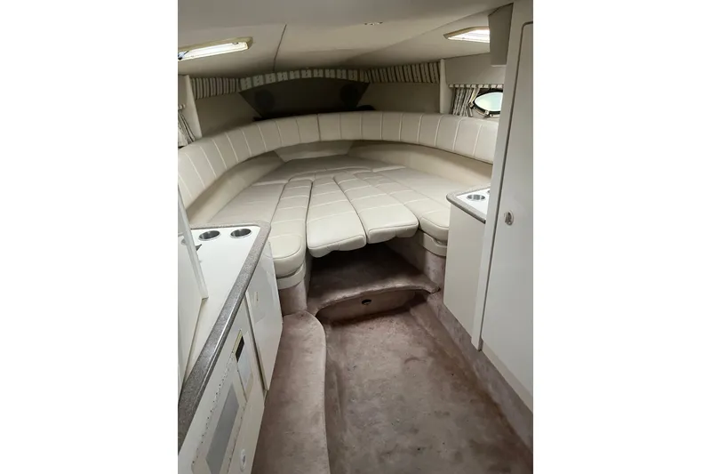Slide: The Image of Interior of 2002 Formula 330 Sun Sport boat with beige seating and compact design. - 56