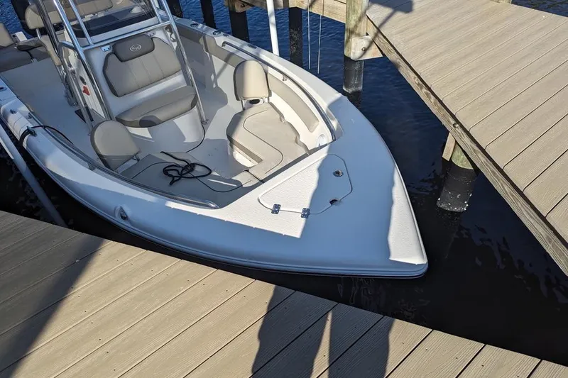 Slide: The Image of 2024 Key West 203 FS boat docked, featuring sleek design and comfortable seating. - 11