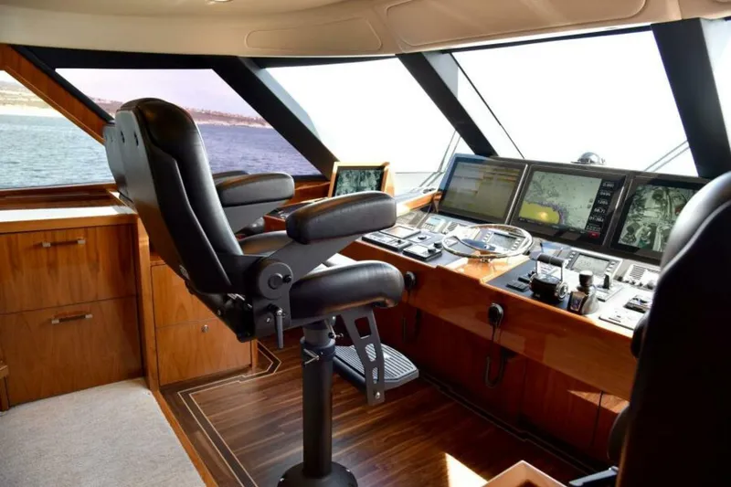 Slide: The Image of Luxurious helm of 2017 Viking 80 Sky Bridge yacht with advanced navigation systems. - 10