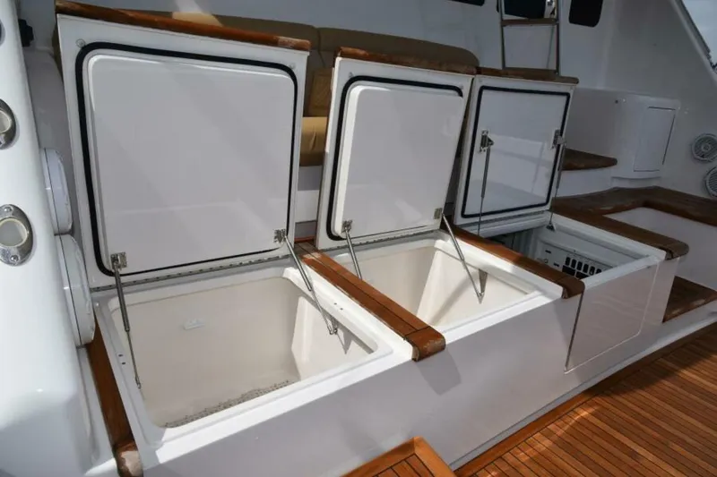 Slide: The Image of Open storage compartments on 2017 Viking 80 Sky Bridge yacht deck. - 100