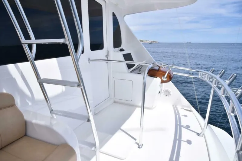 Slide: The Image of 2017 Viking 80 Sky Bridge yacht deck with ocean view and sleek design. - 101