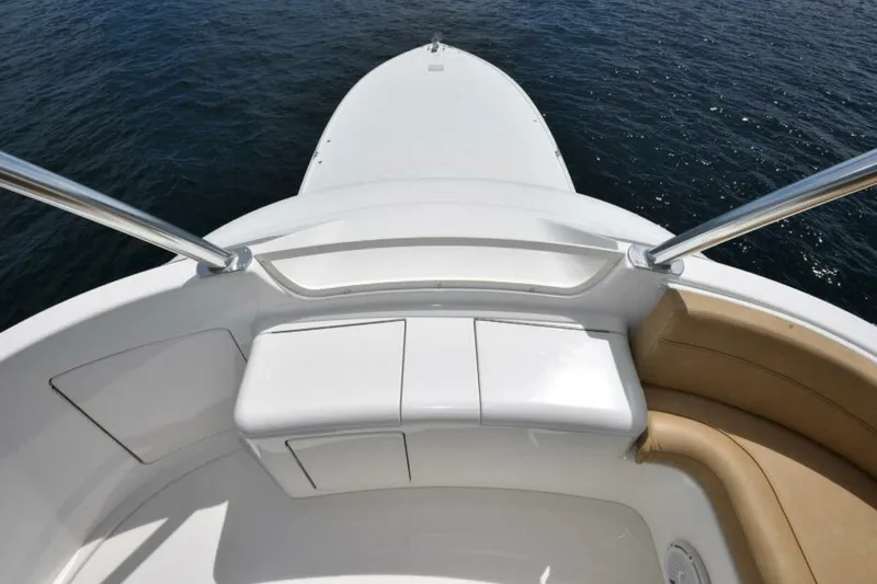 Slide: The Image of 2017 Viking 80 Sky Bridge yacht bow view with sleek design and ocean backdrop. - 106