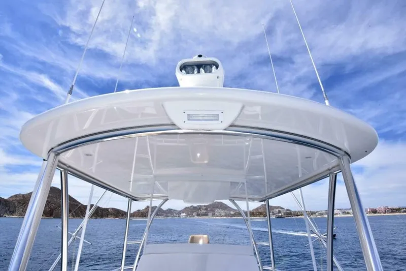 Slide: The Image of 2017 Viking 80 Sky Bridge yacht with sleek design on open water. - 108