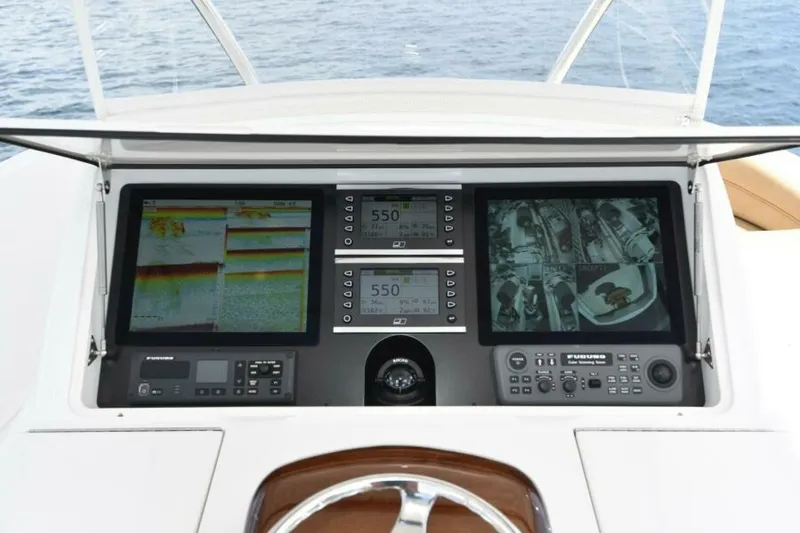 Slide: The Image of Helm of 2017 Viking 80 Sky Bridge yacht with advanced navigation displays. - 115