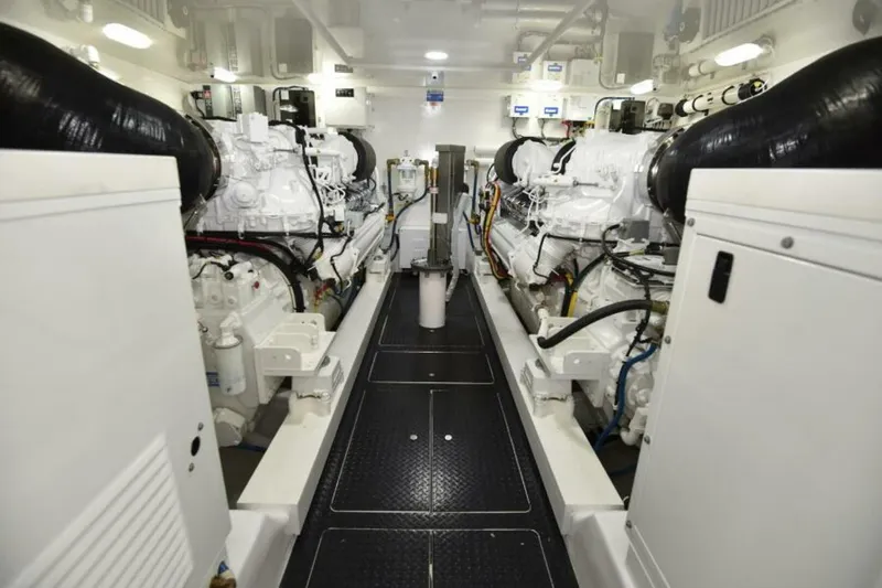 Slide: The Image of Engine room of 2017 Viking 80 Sky Bridge yacht, showcasing dual engines and mechanical systems. - 117