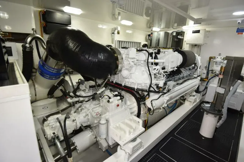Slide: The Image of Engine room of 2017 Viking 80 Sky Bridge yacht, showcasing powerful machinery and components. - 118