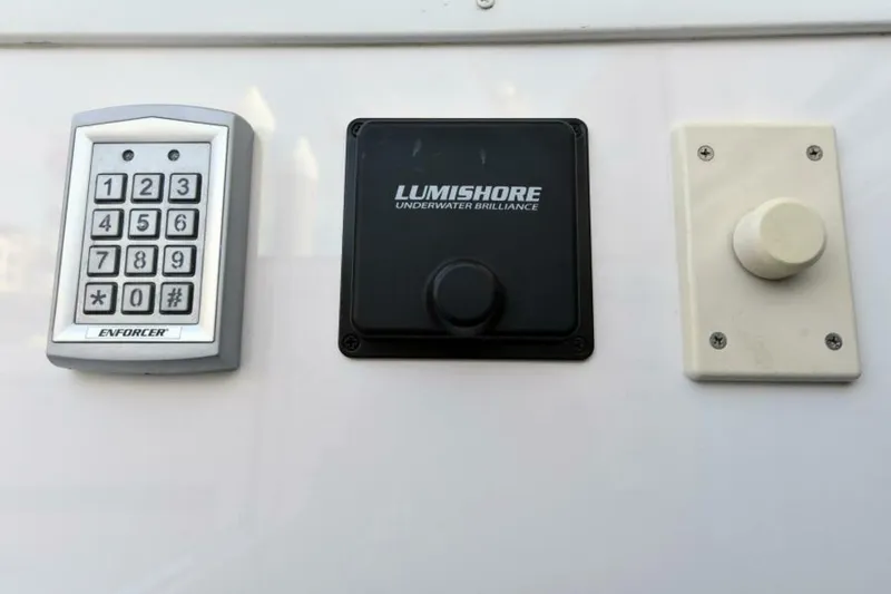 Slide: The Image of Keypad, Lumishore control, and switch on 2017 Viking 80 Sky Bridge yacht. - 121