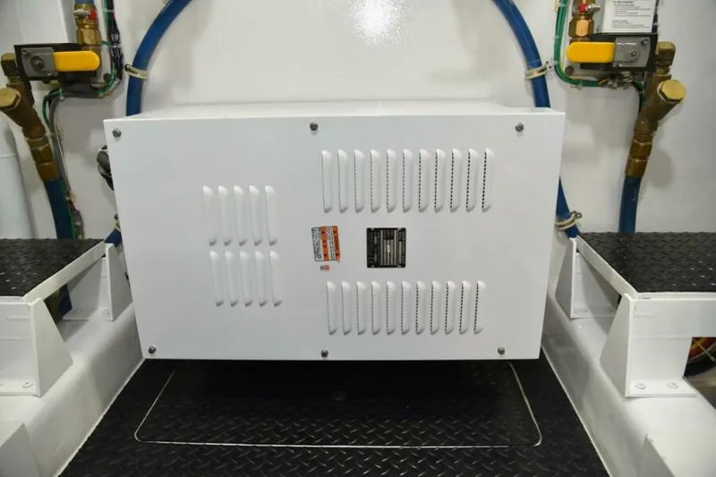 Slide: The Image of Engine room of 2017 Viking 80 Sky Bridge yacht, featuring equipment and piping. - 122