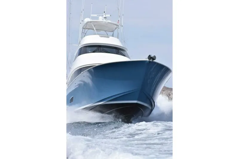 Slide: The Image of 2017 Viking 80 Sky Bridge yacht cruising on open water, showcasing sleek design and powerful performance. - 125