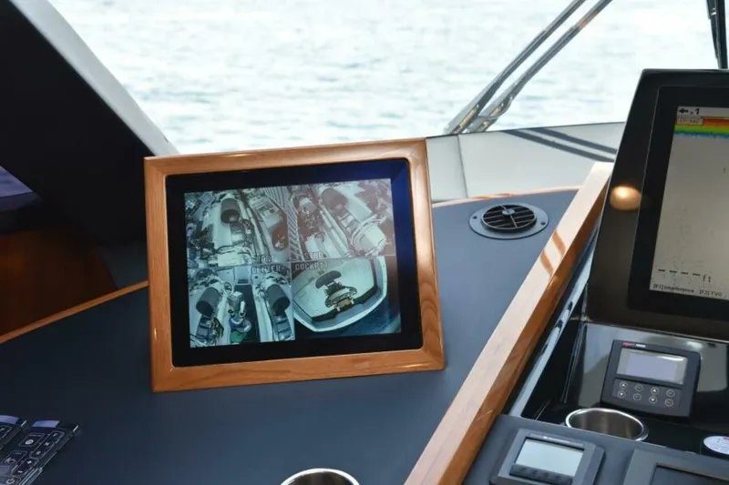 Slide: The Image of Control panel of 2017 Viking 80 Sky Bridge yacht with surveillance display. - 13