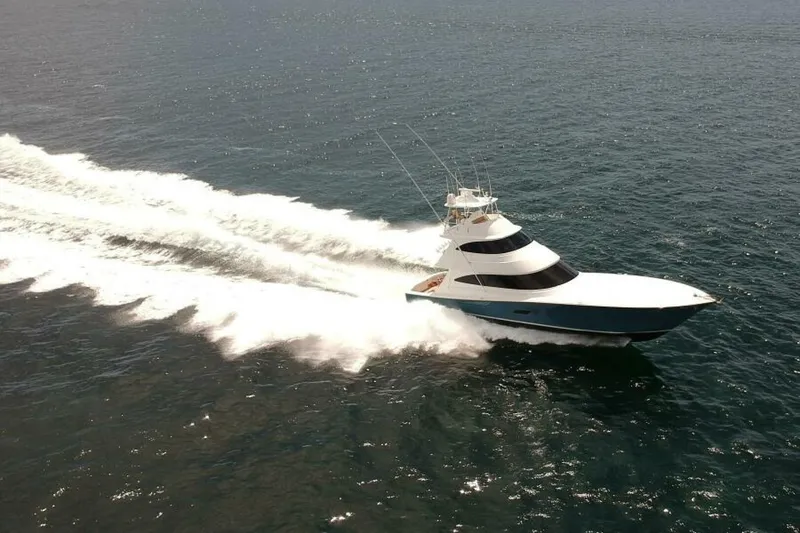 Slide: The Image of 2017 Viking 80 Sky Bridge yacht cruising swiftly on open water. - 130