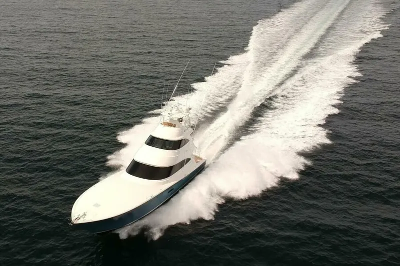 Slide: The Image of 2017 Viking 80 Sky Bridge yacht cruising swiftly on open water. - 131