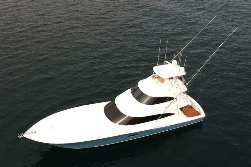 Slide: The Image of 2017 Viking 80 Sky Bridge yacht on open water, aerial view. - 136