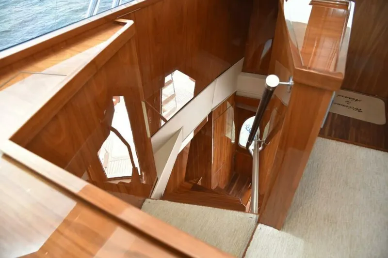 Slide: The Image of Luxurious wooden staircase on 2017 Viking 80 Sky Bridge yacht interior. - 19