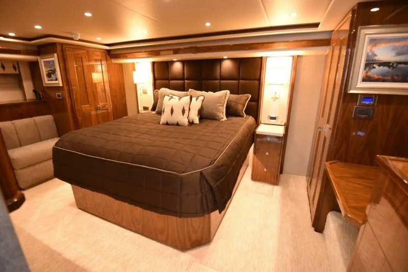 Slide: The Image of Luxurious bedroom interior of 2017 Viking 80 Sky Bridge yacht with elegant wood finishes. - 2