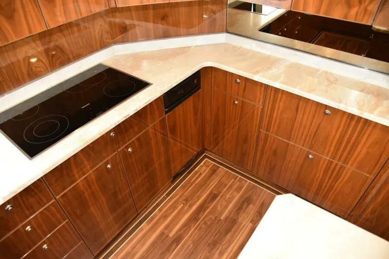 Slide: The Image of Luxurious wooden kitchen interior of 2017 Viking 80 Sky Bridge yacht. - 26