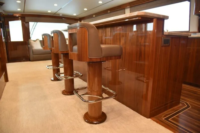 Slide: The Image of Luxurious interior of 2017 Viking 80 Sky Bridge yacht with elegant bar stools. - 28