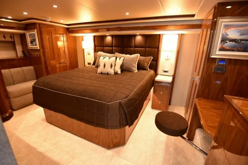 Slide: The Image of Luxurious bedroom interior of 2017 Viking 80 Sky Bridge yacht with elegant wood finishes. - 35