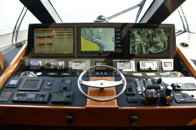 Slide: The Image of Cockpit of 2017 Viking 80 Sky Bridge yacht with advanced navigation systems and controls. - 4