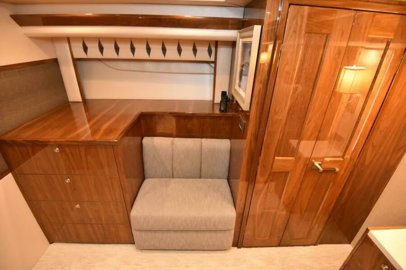 Slide: The Image of Luxurious interior of 2017 Viking 80 Sky Bridge yacht with elegant wood finish. - 41