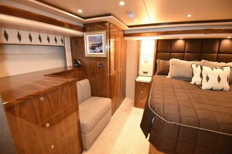 Slide: The Image of Luxurious bedroom interior of 2017 Viking 80 Sky Bridge yacht with elegant wood finishes. - 46
