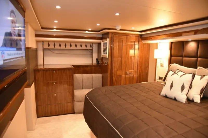 Slide: The Image of Luxurious bedroom interior of 2017 Viking 80 Sky Bridge yacht with elegant wood finishes. - 49