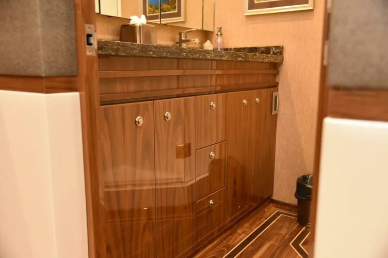 Slide: The Image of Luxurious wooden cabinetry in 2017 Viking 80 Sky Bridge yacht interior. - 51
