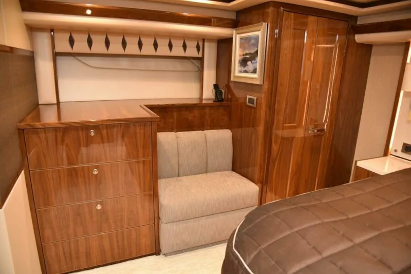 Slide: The Image of Luxurious interior of 2017 Viking 80 Sky Bridge yacht with wood finishes and elegant furnishings. - 52