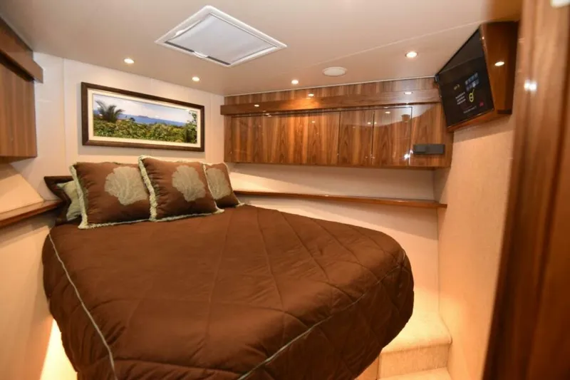 Slide: The Image of Luxurious cabin interior of 2017 Viking 80 Sky Bridge yacht with cozy bedding. - 54