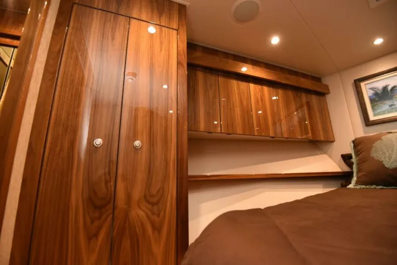 Slide: The Image of Luxurious wood interior of 2017 Viking 80 Sky Bridge yacht cabin. - 55
