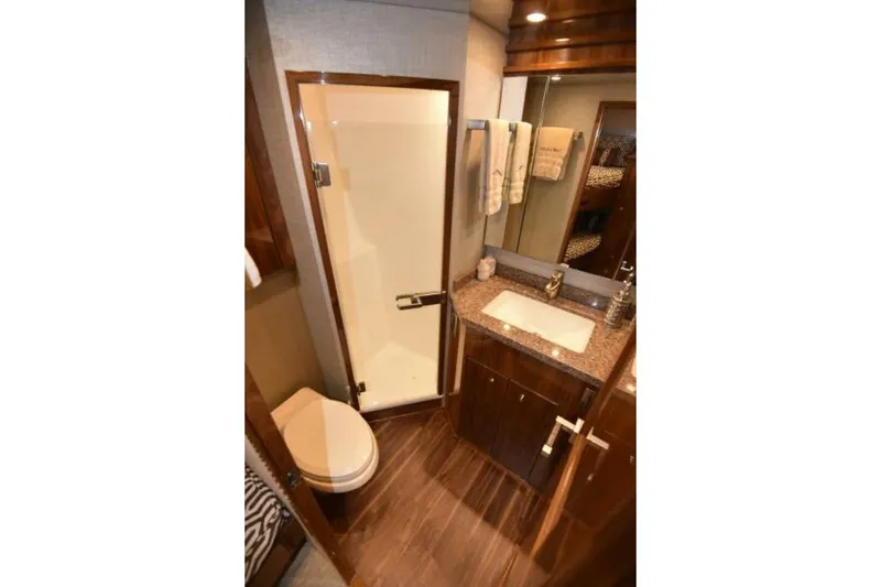Slide: The Image of Luxurious bathroom in 2017 Viking 80 Sky Bridge yacht with modern amenities. - 61