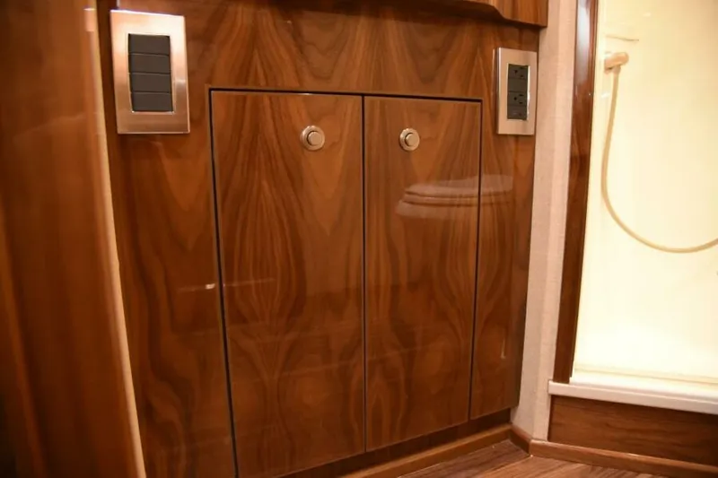 Slide: The Image of Luxurious wooden cabinetry in 2017 Viking 80 Sky Bridge yacht interior. - 73