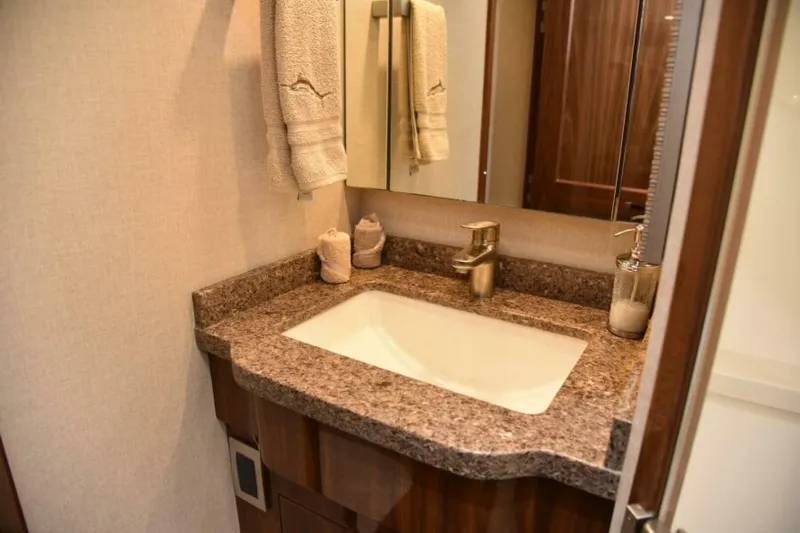 Slide: The Image of Luxurious bathroom vanity in 2017 Viking 80 Sky Bridge yacht. - 74