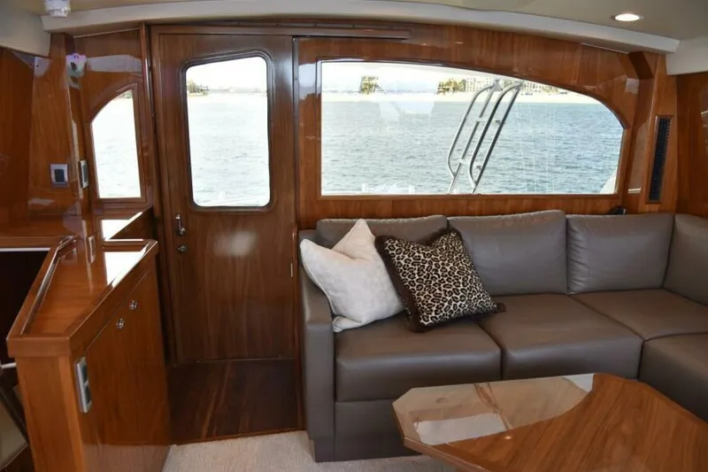 Slide: The Image of Luxurious interior of 2017 Viking 80 Sky Bridge yacht with elegant wood finish and plush seating. - 8