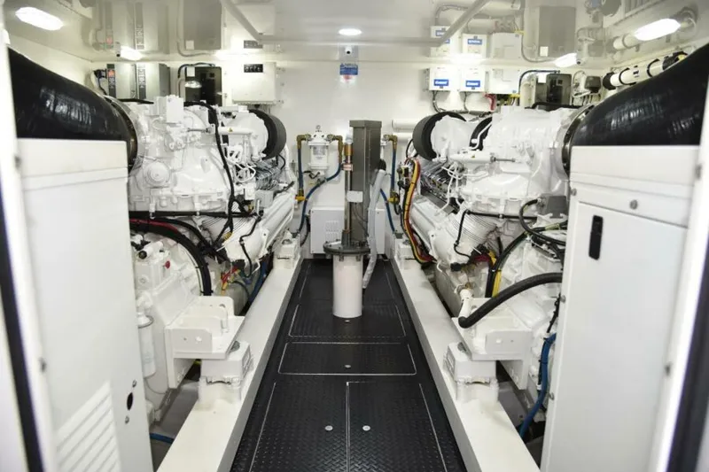 Slide: The Image of Engine room of 2017 Viking 80 Sky Bridge yacht, showcasing dual engines and mechanical systems. - 83