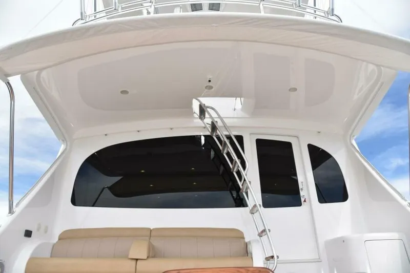 Slide: The Image of 2017 Viking 80 Sky Bridge yacht with sleek design and modern seating area. - 86